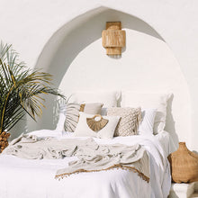 Load image into Gallery viewer, Cream boho cushion on beautiful boho styled bed. Cream cushion with seagrass cushion accessory.
