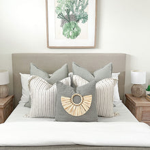Load image into Gallery viewer, Sage green cushion for a coastal inspired home. Featuring a bamboo cushion accessory.
