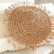 Load image into Gallery viewer, White boho cushion with stone natural colour strip wrapped around the cushion with a woven raffia disk attached to the front. The perfect Boho Accessory.

